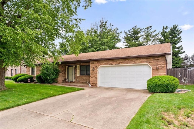 617 Deerfield Dr, Swansea, IL 62226 - ranch-style home with brick siding, an attached garage, and concrete driveway