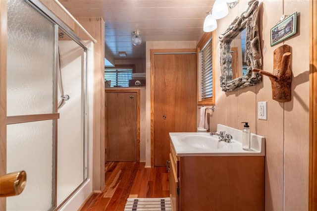 2441 Alpine Lake Dr, Innsbrook, MO 63390 - bathroom featuring vanity, a stall shower, and wood finished floors