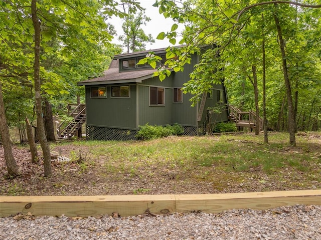 2441 Alpine Lake Dr, Innsbrook, MO 63390 - view of property exterior featuring stairs and a deck