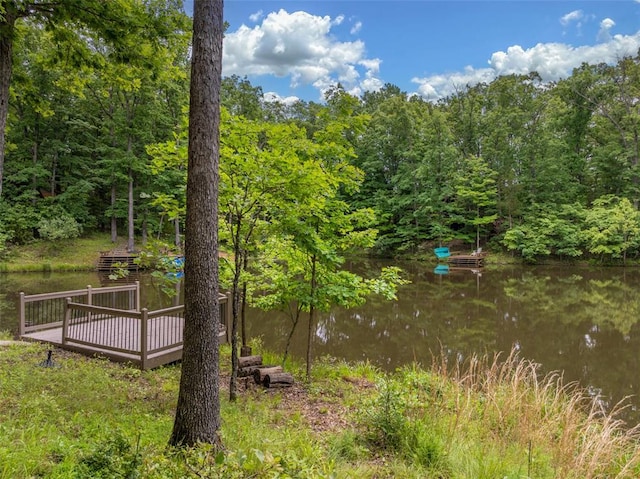2441 Alpine Lake Dr, Innsbrook, MO 63390 - view of yard featuring a deck with water view and a view of trees