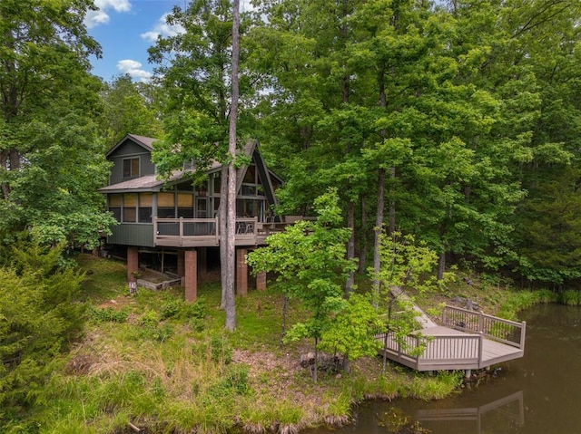 2441 Alpine Lake Dr, Innsbrook, MO 63390 - rear view of house with a deck with water view and a sunroom