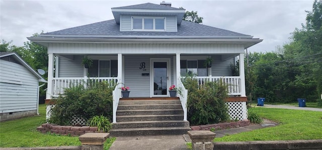 220 N 9th St, Murphysboro, IL 62966 - bungalow-style home featuring roof with shingles, a porch, and a front lawn