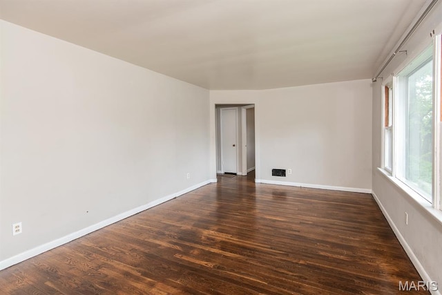 190 Anistasia Dr, Saint Louis, MO 63135 - spare room with dark wood-type flooring, healthy amount of natural light, and baseboards