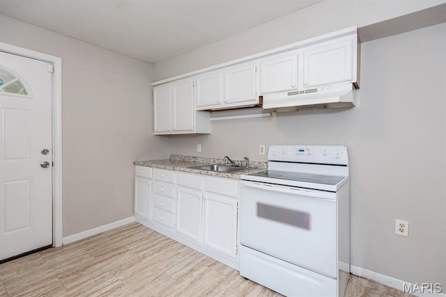 190 Anistasia Dr, Saint Louis, MO 63135 - kitchen with white electric range oven, under cabinet range hood, a sink, light wood-style floors, and light countertops