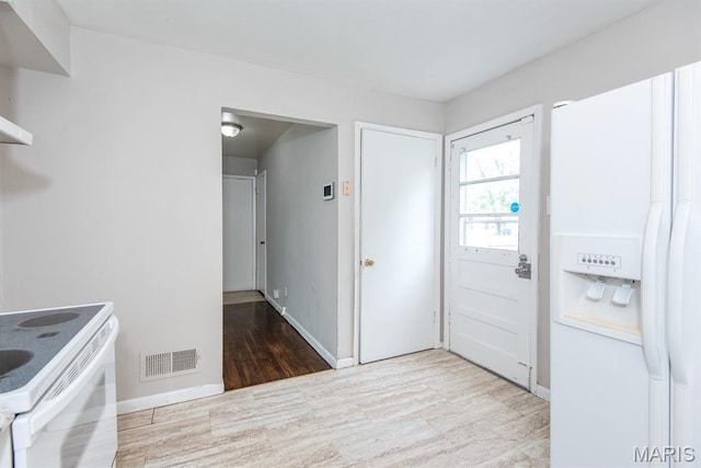 190 Anistasia Dr, Saint Louis, MO 63135 - kitchen featuring wood finished floors, white appliances, and baseboards
