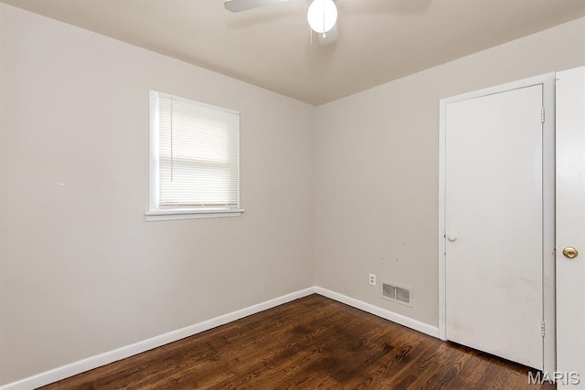 190 Anistasia Dr, Saint Louis, MO 63135 - spare room featuring dark wood-type flooring, ceiling fan, and baseboards