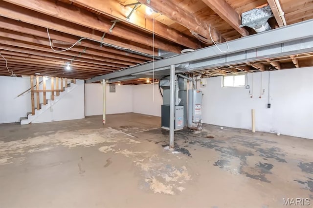 190 Anistasia Dr, Saint Louis, MO 63135 - below grade area with water heater, stairs, and heating unit