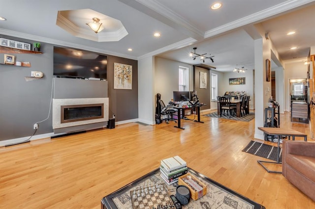 2628 Indiana Ave, Saint Louis, MO 63118 - living area with crown molding, a glass covered fireplace, wood finished floors, baseboards, and recessed lighting
