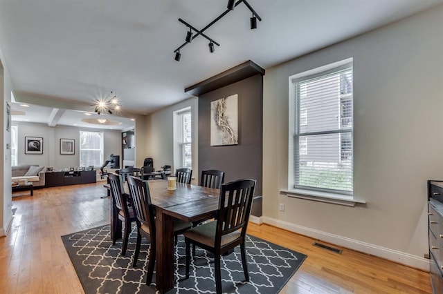 2628 Indiana Ave, Saint Louis, MO 63118 - dining area featuring light wood-style floors, plenty of natural light, and baseboards