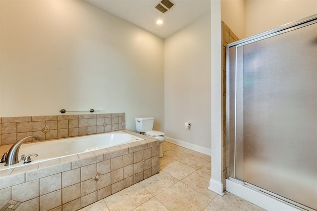 2628 Indiana Ave, Saint Louis, MO 63118 - full bathroom featuring toilet, a bath, a shower stall, tile patterned flooring, and baseboards