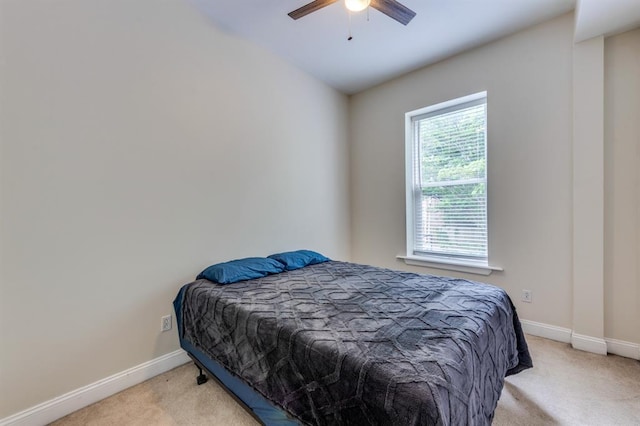 2628 Indiana Ave, Saint Louis, MO 63118 - bedroom with light colored carpet, baseboards, and a ceiling fan