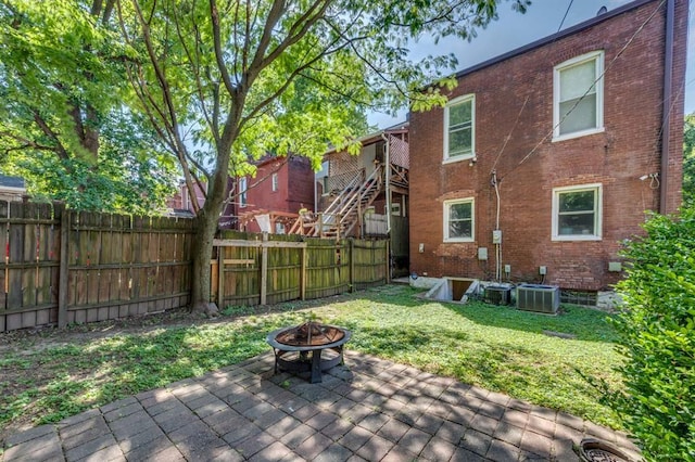 2628 Indiana Ave, Saint Louis, MO 63118 - deck featuring a fire pit, central AC, and a patio area