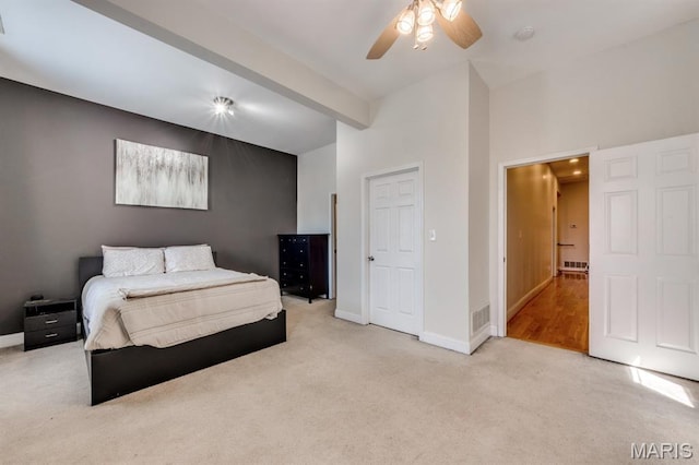 2628 Indiana Ave, Saint Louis, MO 63118 - carpeted bedroom featuring baseboards, beamed ceiling, and a ceiling fan