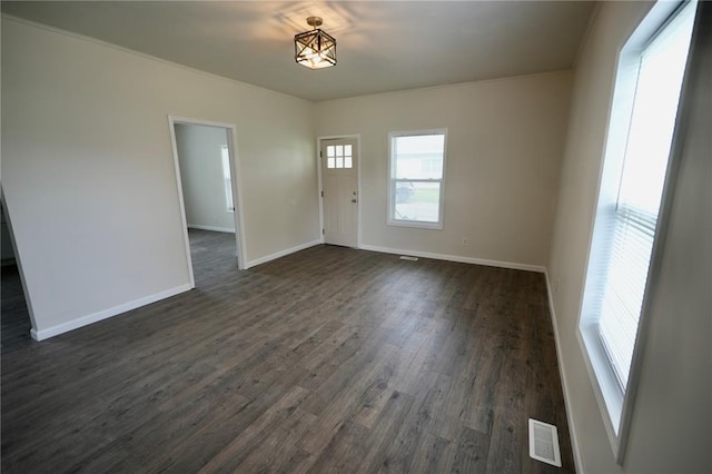 300 W Baker St, Gillespie, IL 62033 - empty room featuring dark wood finished floors and baseboards