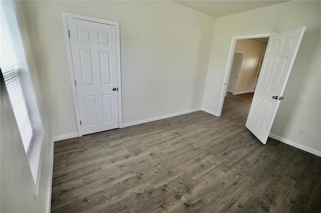 300 W Baker St, Gillespie, IL 62033 - spare room featuring dark wood-style flooring and baseboards