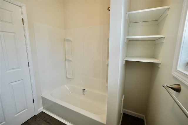 300 W Baker St, Gillespie, IL 62033 - full bathroom featuring bathtub / shower combination, baseboards, and wood finished floors