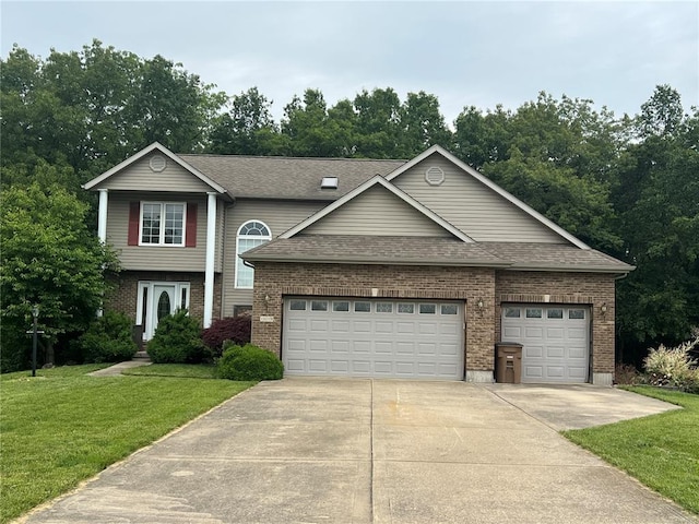 1059 Wolf Crk, Staunton, IL 62088 - traditional-style home featuring concrete driveway, brick siding, a front yard, a garage, and a shingled roof
