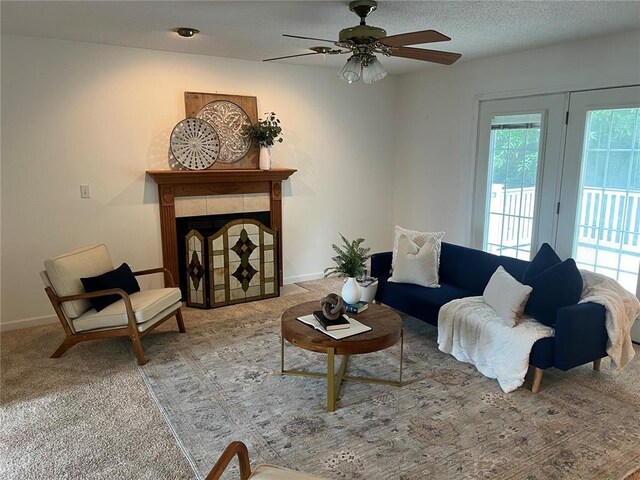 1059 Wolf Crk, Staunton, IL 62088 - living area with carpet flooring, a fireplace, a ceiling fan, and baseboards