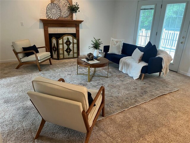 1059 Wolf Crk, Staunton, IL 62088 - carpeted living area featuring baseboards and a tile fireplace