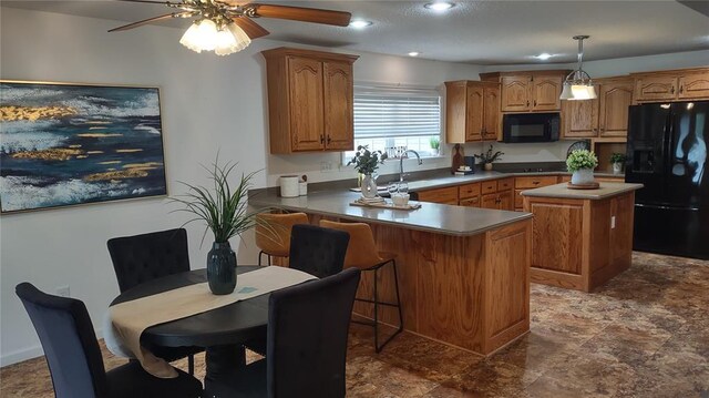 1059 Wolf Crk, Staunton, IL 62088 - kitchen featuring black appliances, brown cabinets, a kitchen island, a ceiling fan, and recessed lighting