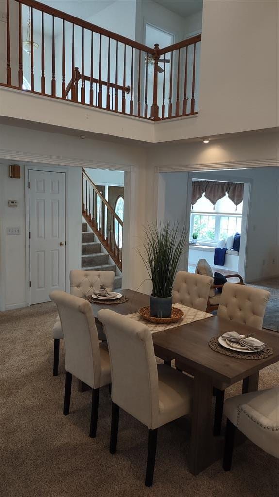1059 Wolf Crk, Staunton, IL 62088 - dining area featuring stairway, a high ceiling, and carpet