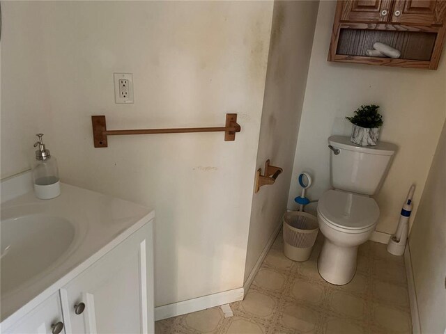 1059 Wolf Crk, Staunton, IL 62088 - bathroom with toilet, tile patterned floors, vanity, and baseboards