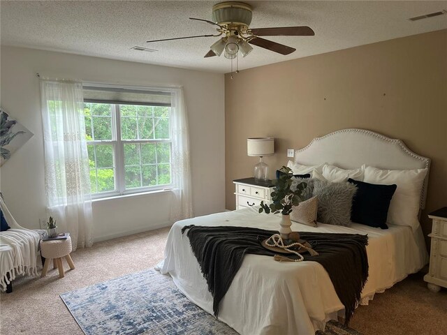 1059 Wolf Crk, Staunton, IL 62088 - carpeted bedroom with a textured ceiling and a ceiling fan
