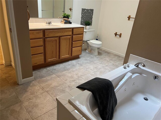1059 Wolf Crk, Staunton, IL 62088 - full bathroom featuring vanity, a tub with jets, toilet, baseboards, and tile patterned floors