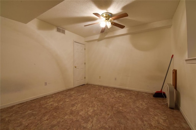 1059 Wolf Crk, Staunton, IL 62088 - empty room with ceiling fan and a textured ceiling