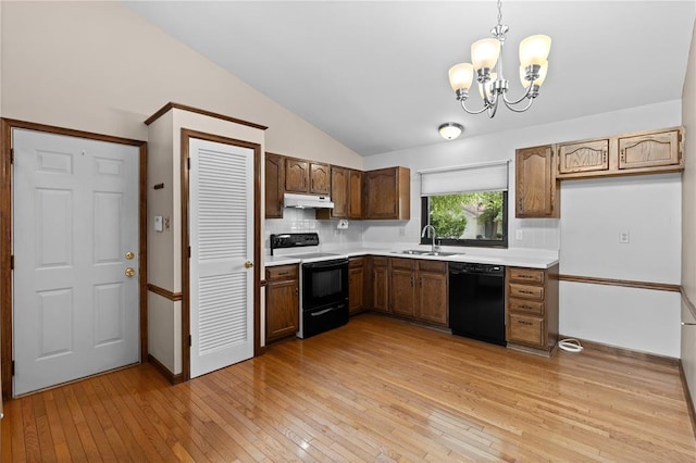 102 S Willow Grove Ct, Saint Peters, MO 63376 - kitchen featuring electric stove, black dishwasher, under cabinet range hood, a sink, and lofted ceiling