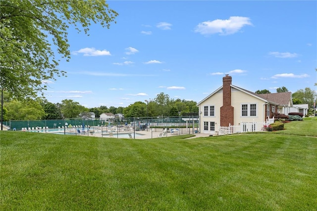 102 S Willow Grove Ct, Saint Peters, MO 63376 - back of property with a chimney, a community pool, and a patio area