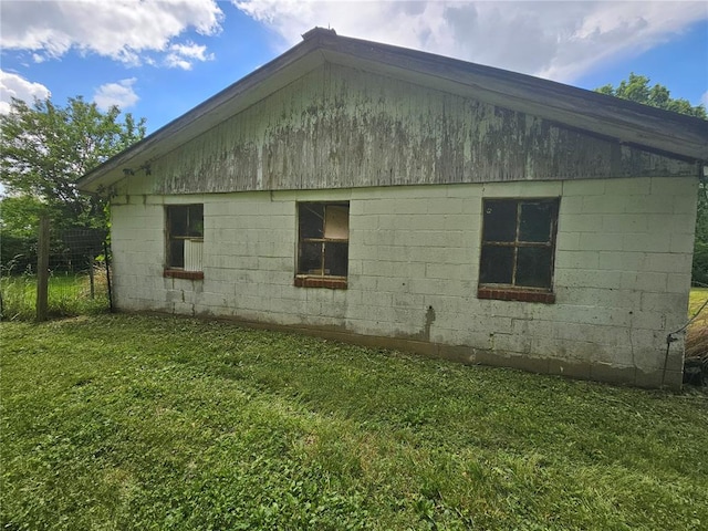 9119 Pearidge Rd, Baldwin, IL 62217 - view of home's exterior featuring concrete block siding and a lawn