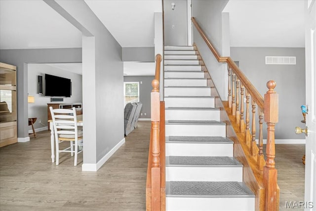 301 Sassafras Parc Dr, Ofallon, MO 63368 - staircase with wood finished floors and baseboards