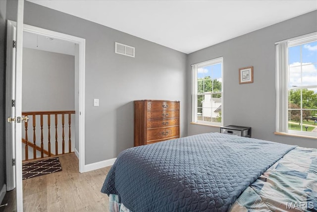 301 Sassafras Parc Dr, Ofallon, MO 63368 - bedroom with light wood finished floors and baseboards