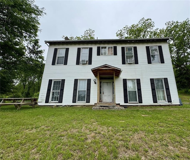 10321 Old 79, Hannibal, MO 63401 - colonial home with a front lawn and cooling unit