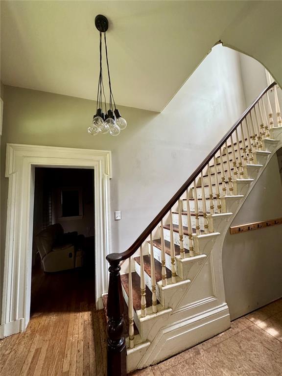 10321 Old 79, Hannibal, MO 63401 - stairs with a chandelier and wood finished floors