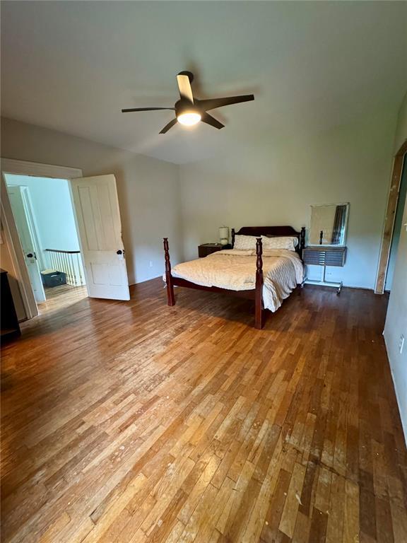10321 Old 79, Hannibal, MO 63401 - unfurnished bedroom featuring hardwood / wood-style floors and ceiling fan