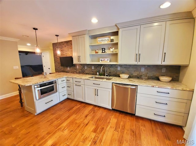 3 Janney Cir, Canton, MO 63435 - kitchen featuring stainless steel appliances, a sink, a peninsula, backsplash, and open shelves