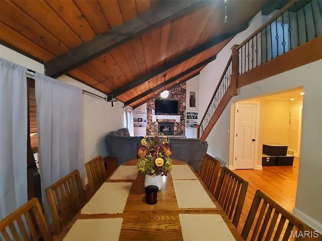 3 Janney Cir, Canton, MO 63435 - dining area featuring wood finished floors, stairway, wood ceiling, and a stone fireplace