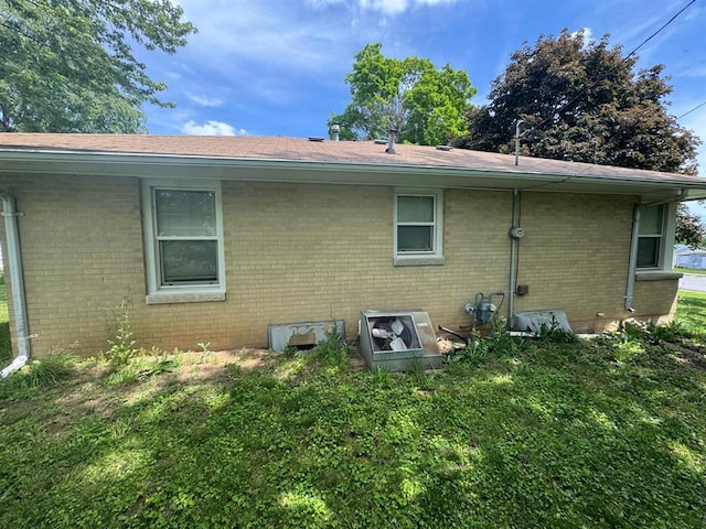511 N 5th St, La Grange, MO 63448 - rear view of property featuring brick siding and roof with shingles