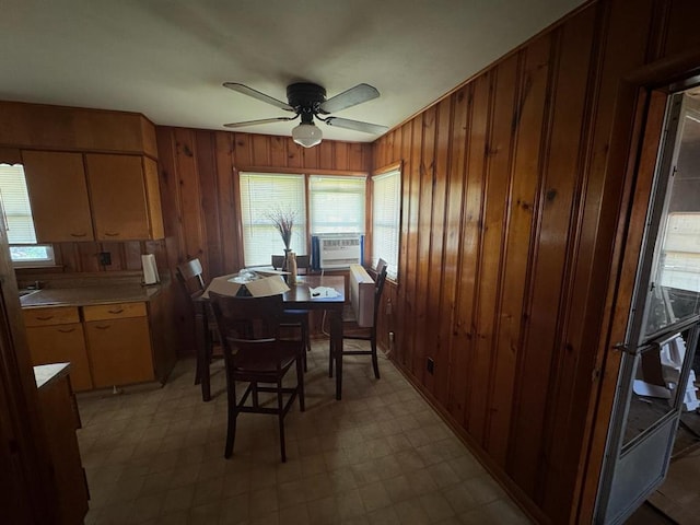 511 N 5th St, La Grange, MO 63448 - dining room featuring plenty of natural light, wooden walls, ceiling fan, light floors, and cooling unit