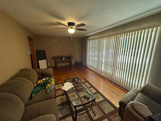 511 N 5th St, La Grange, MO 63448 - living area with a ceiling fan, wood finished floors, and baseboards