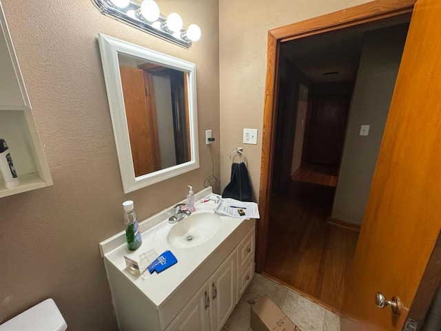 511 N 5th St, La Grange, MO 63448 - bathroom featuring vanity, toilet, and tile patterned floors