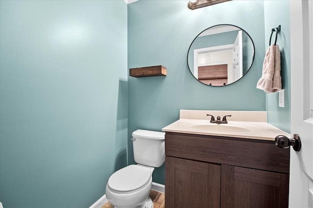 1406 Tisbury Cir, Ofallon, MO 63366 - bathroom with toilet, vanity, and baseboards