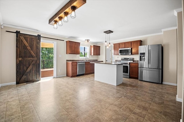 1406 Tisbury Cir, Ofallon, MO 63366 - kitchen featuring appliances with stainless steel finishes, a barn door, baseboards, crown molding, and brown cabinetry