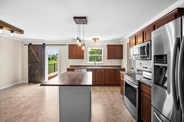 1406 Tisbury Cir, Ofallon, MO 63366 - kitchen featuring stainless steel appliances, a sink, backsplash, ornamental molding, and hanging light fixtures