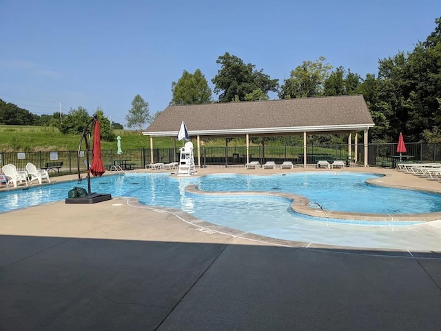1406 Tisbury Cir, Ofallon, MO 63366 - community pool featuring a patio