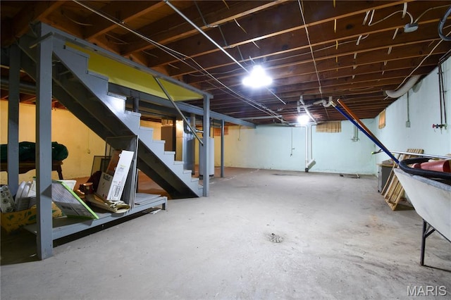 411 S Walnut St, Mount Olive, IL 62069 - unfinished basement featuring stairway