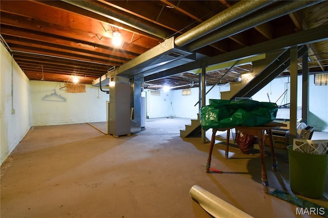 411 S Walnut St, Mount Olive, IL 62069 - basement with stairway and heating unit