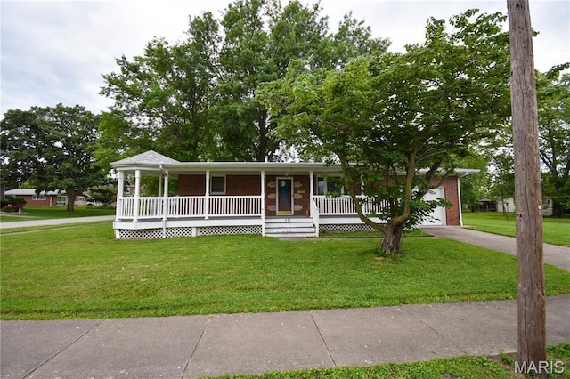 411 S Walnut St, Mount Olive, IL 62069 - view of front of house featuring covered porch, brick siding, a front lawn, driveway, and an attached garage